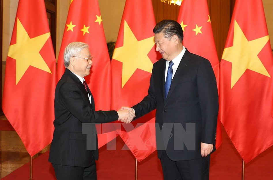 Tổng Bí thư, Chủ tịch nước Trung Quốc Tập Cận Bình đón Tổng Bí thư Nguyễn Phú Trọng. (Ảnh: Trí Dũng/TTXVN)