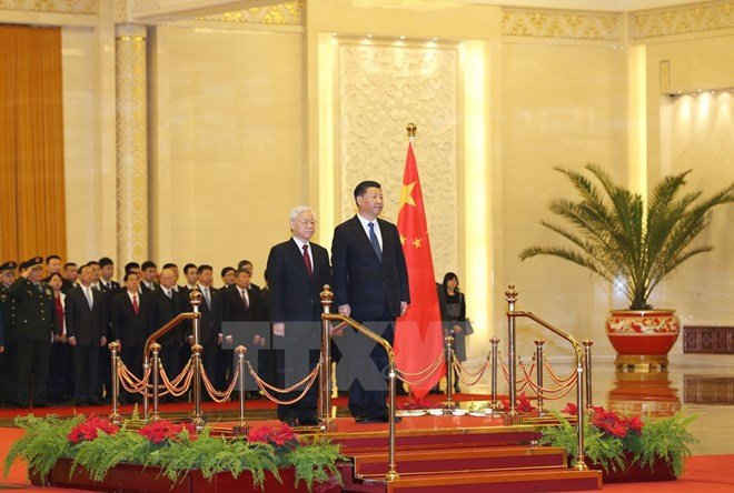 Tổng Bí thư Nguyễn Phú Trọng và Tổng Bí thư, Chủ tịch nước Trung Quốc Tập Cận Bình. (Ảnh: Trí Dũng/TTXVN)